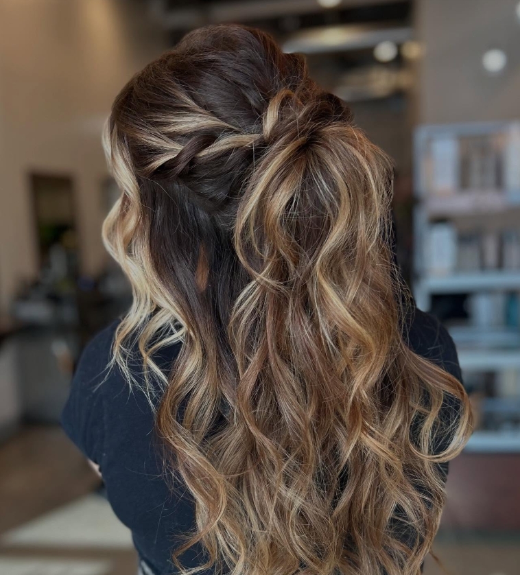Braided half up style on long wavy hair